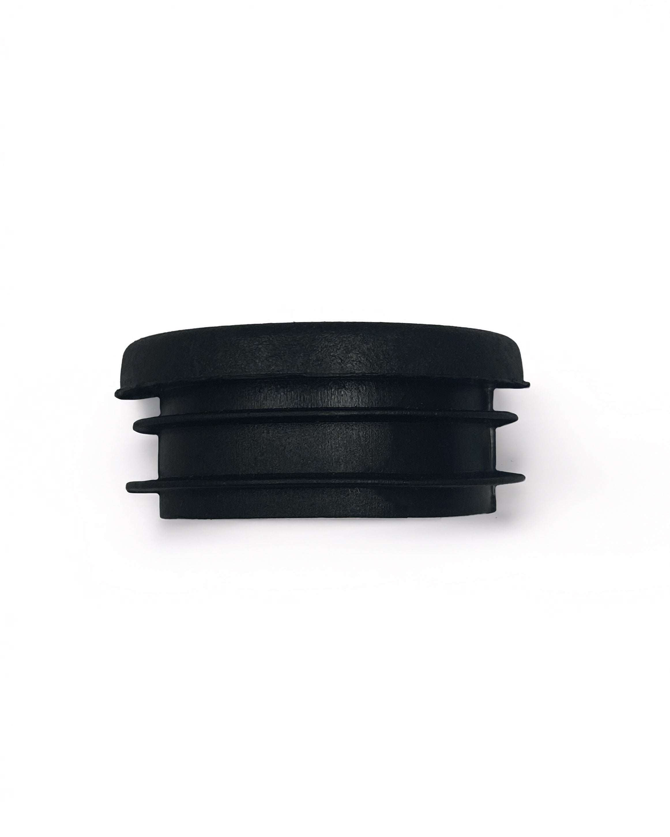 Black round plug to go on the end of a guardrail pole. 