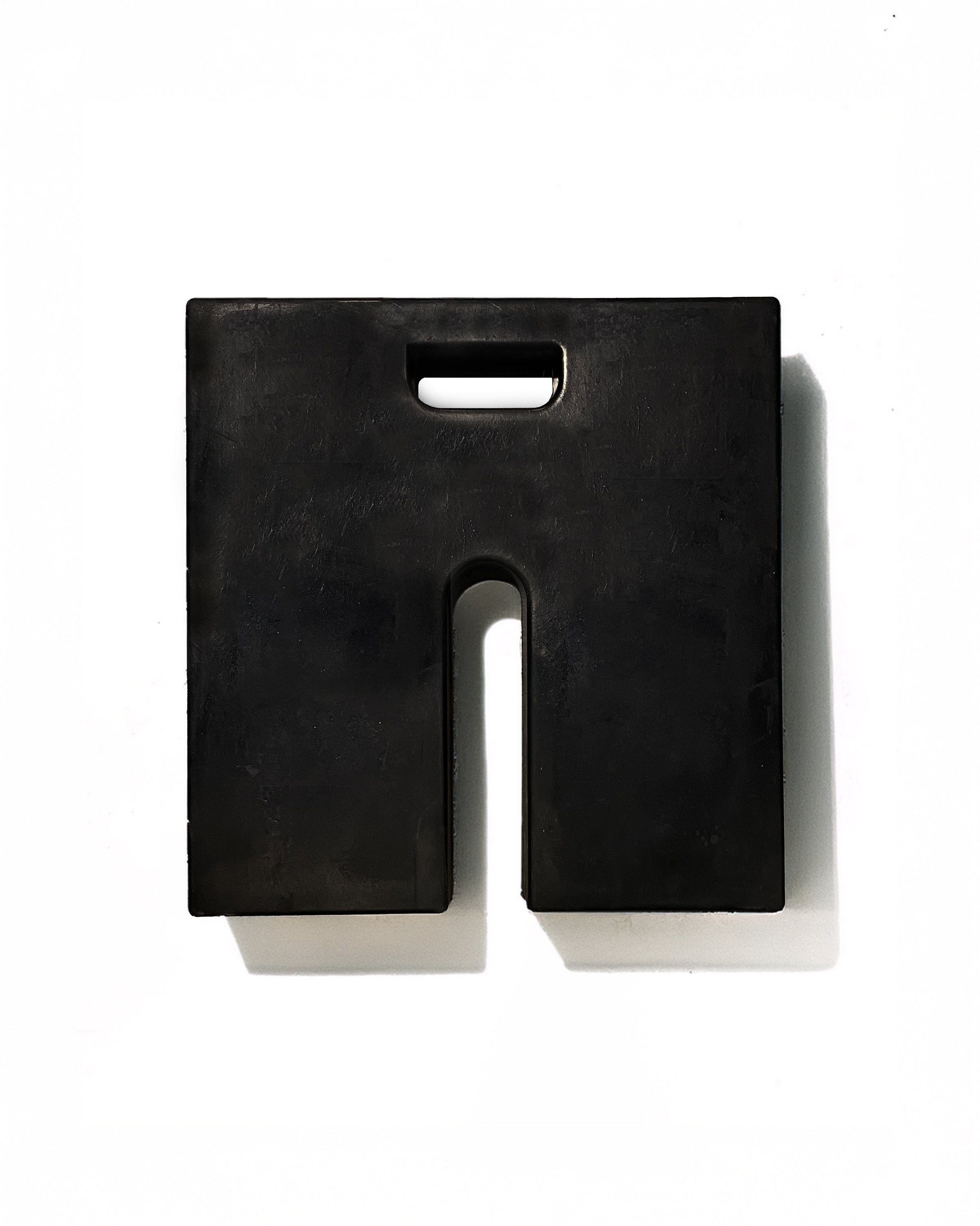 Black base weight for a tent. 18x18x2 and 20lbs